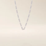 14k solid gold slim Figaro chain necklace with alternating short and long links. A classic and lightweight gold chain. Perfect for layering or daily wear.