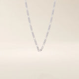14k solid gold slim Figaro chain necklace with alternating short and long links. A classic and lightweight gold chain. Perfect for layering or daily wear.