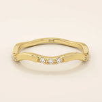 14k solid gold slim stacking ring with a delicate curvy band design and tiny moissanite accents. Minimalist and elegant for everyday wear.