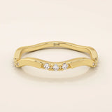 14k solid gold slim stacking ring with a delicate curvy band design and tiny moissanite accents. Minimalist and elegant for everyday wear.