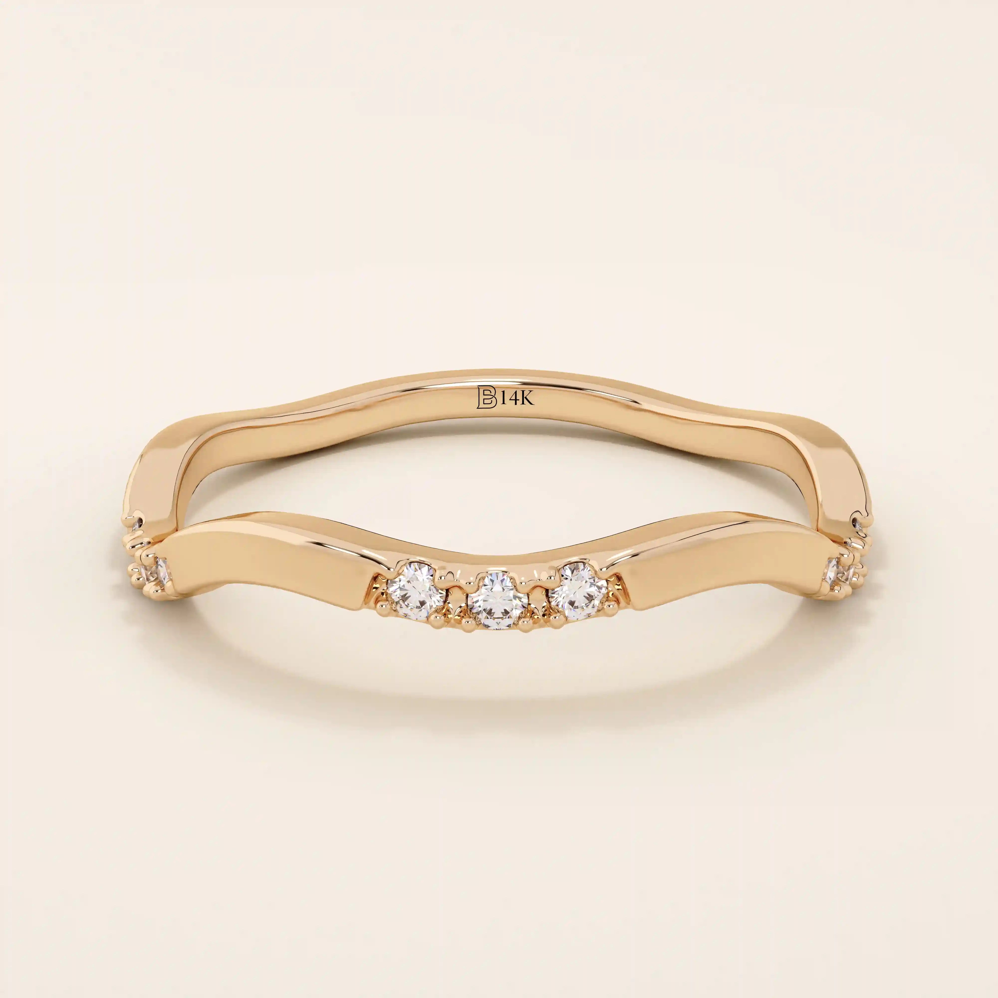 14k solid gold slim stacking ring with a delicate curvy band design and tiny moissanite accents. Minimalist and elegant for everyday wear.