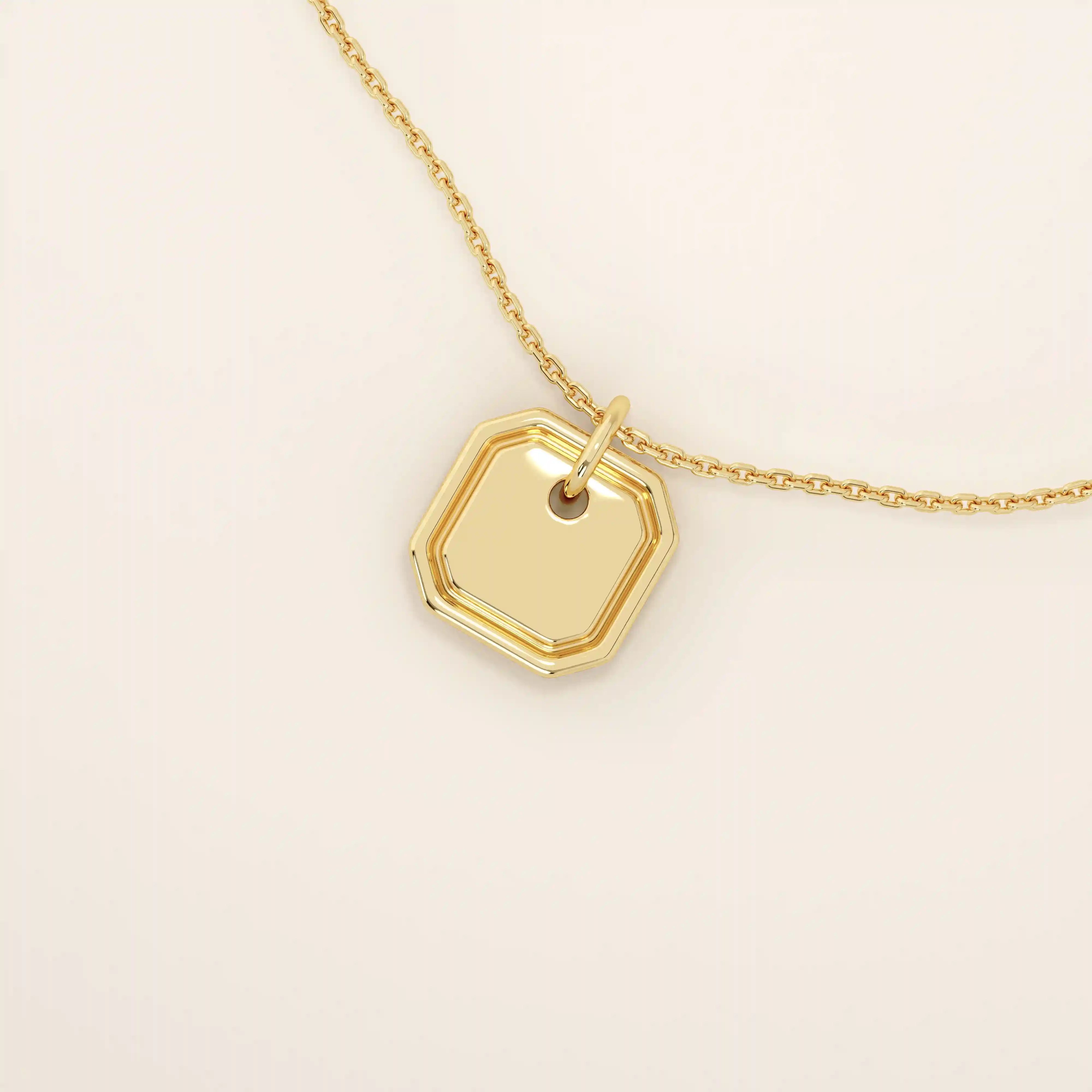14k solid gold small octagon charm pendant with a minimalist shape and polished finish. A simple and timeless gold piece. Great for layering or everyday wear.