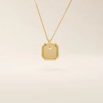 14k solid gold small octagon charm pendant with a minimalist shape and polished finish. A simple and timeless gold piece. Great for layering or everyday wear.