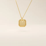 14k solid gold small octagon charm pendant with a minimalist shape and polished finish. A simple and timeless gold piece. Great for layering or everyday wear.