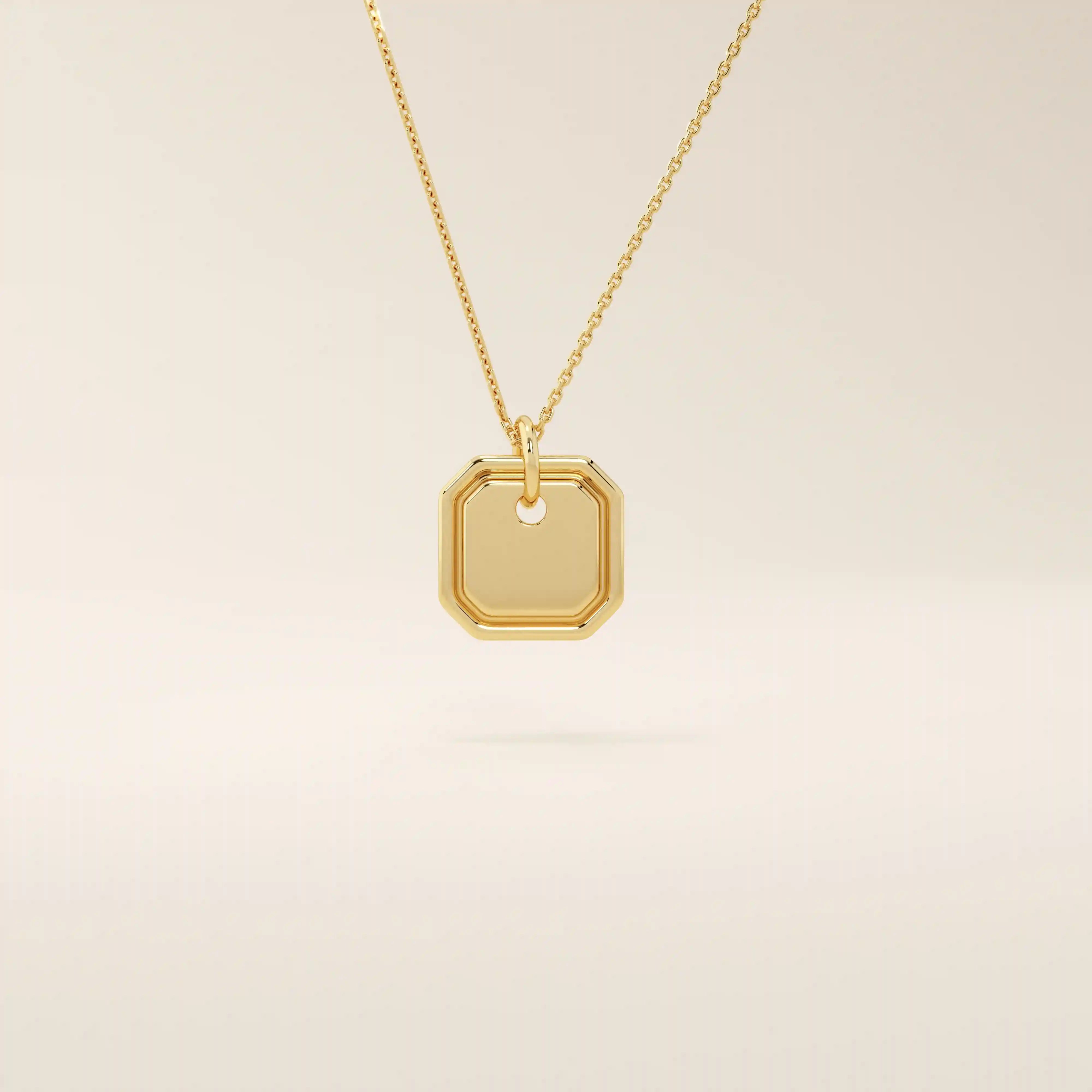 14k solid gold small octagon charm pendant with a minimalist shape and polished finish. A simple and timeless gold piece. Great for layering or everyday wear.