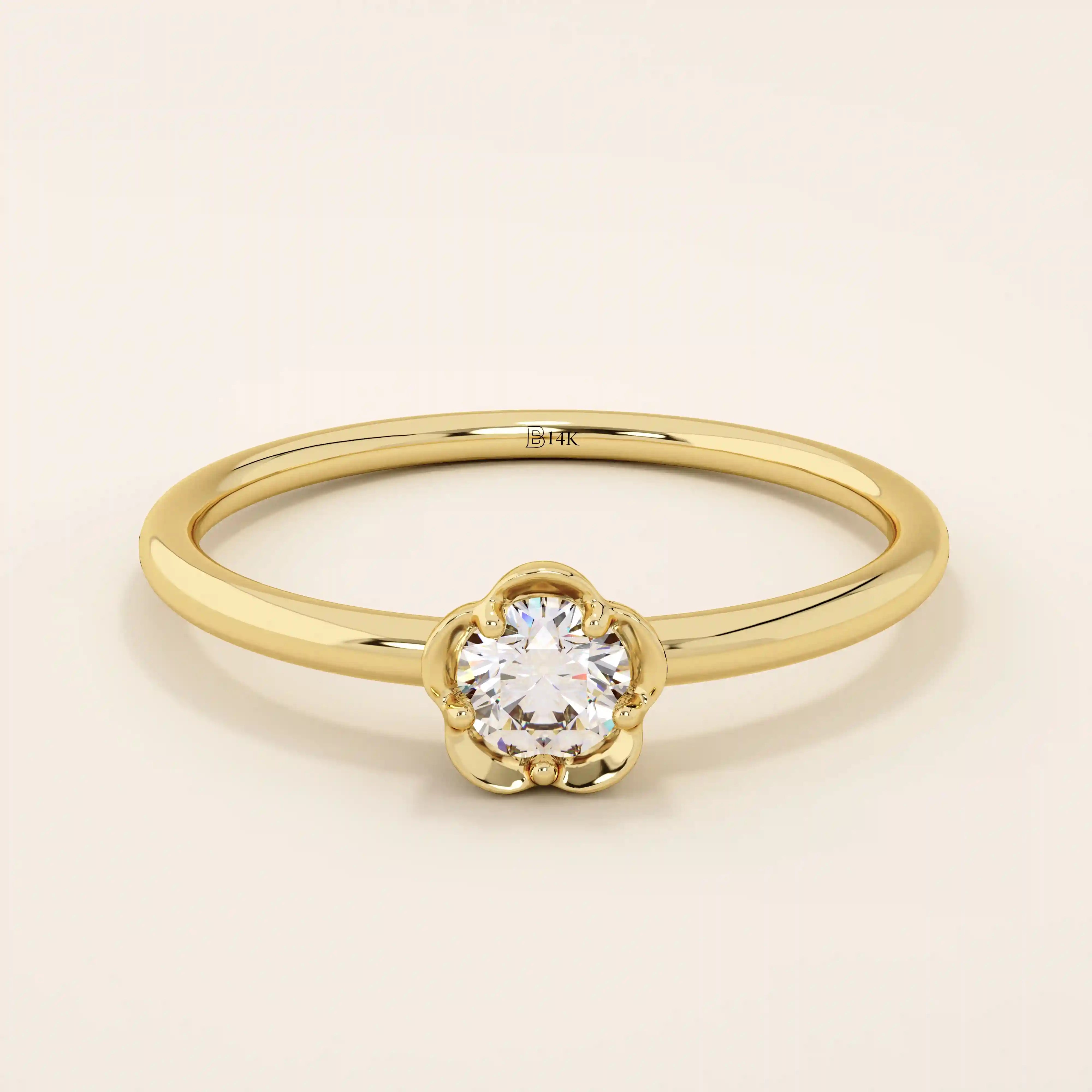 14k solid gold solitaire engagement or promise ring featuring a delicate small flower design. Minimalist and feminine everyday jewelry.