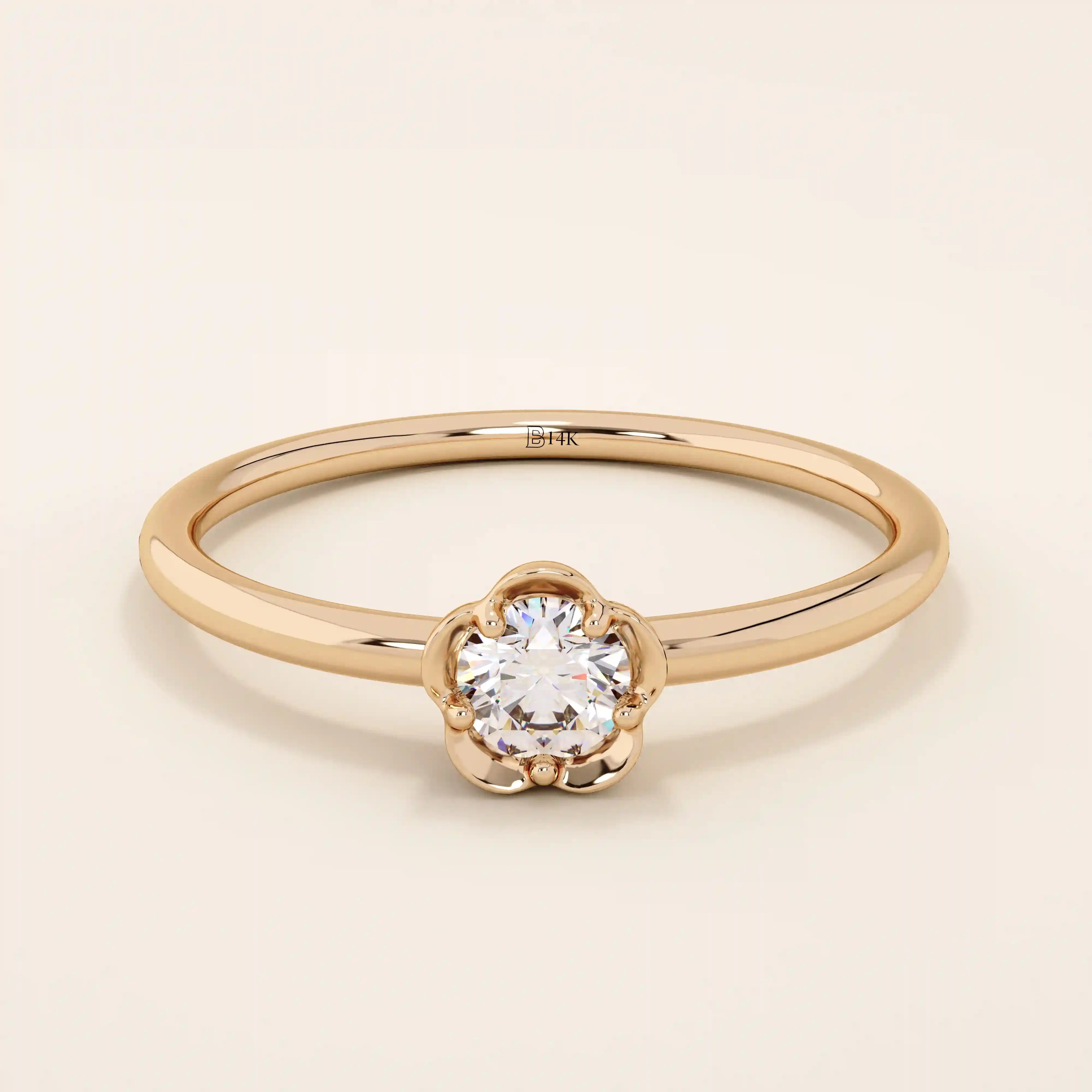 14k solid gold solitaire engagement or promise ring featuring a delicate small flower design. Minimalist and feminine everyday jewelry.