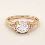 14k solid gold solitaire engagement ring featuring intricate Celtic knot detailing and subtle accent moissanites. Unique and timeless design for modern brides.
