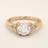 14k solid gold solitaire engagement ring featuring intricate Celtic knot detailing and subtle accent moissanites. Unique and timeless design for modern brides.