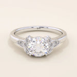 14k solid gold solitaire engagement ring featuring intricate Celtic knot detailing and subtle accent moissanites. Unique and timeless design for modern brides.