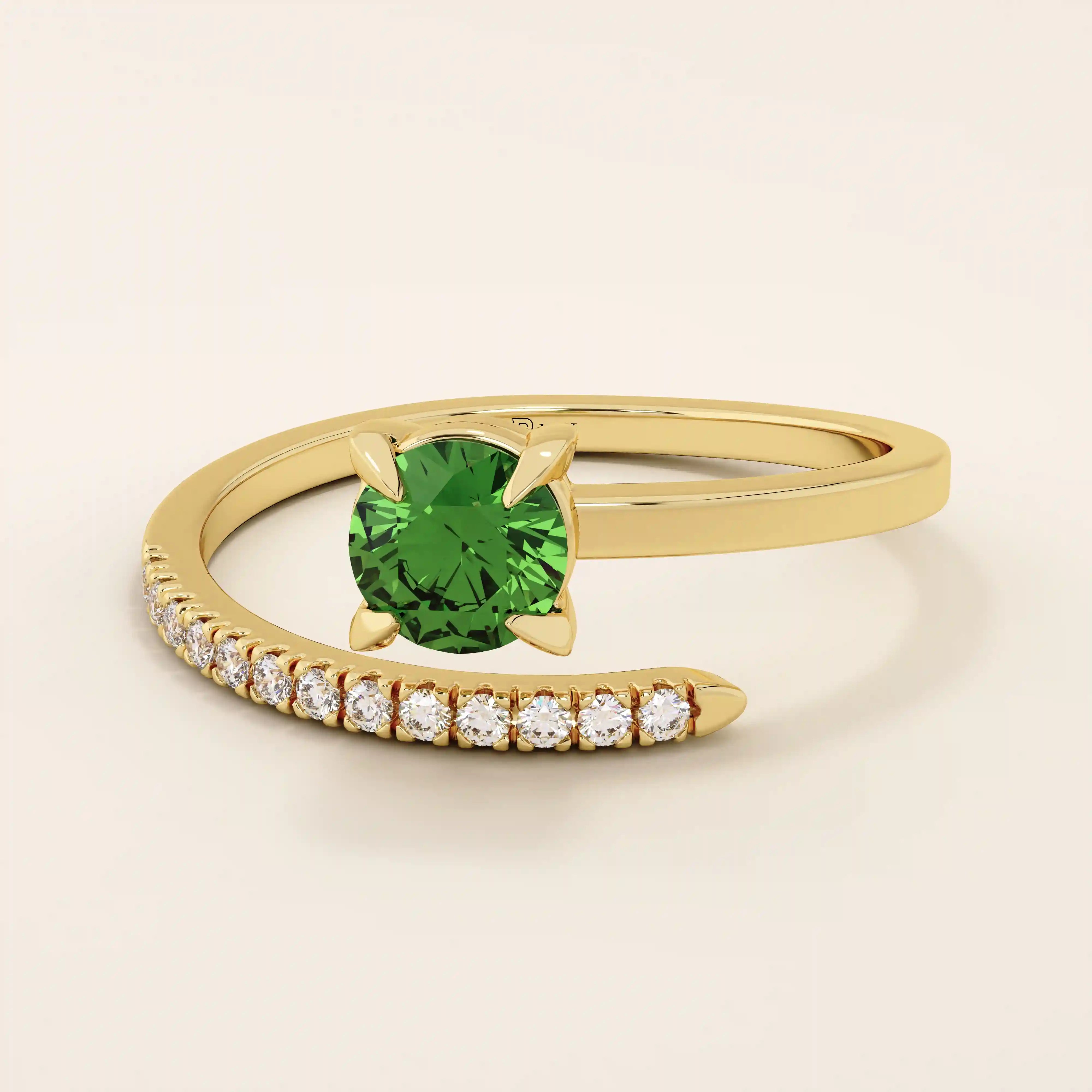 14k solid gold spiral wrap ring featuring a vivid green emerald gemstone. A bold yet elegant design with fluid curves. Perfect as a statement ring or unique gift.