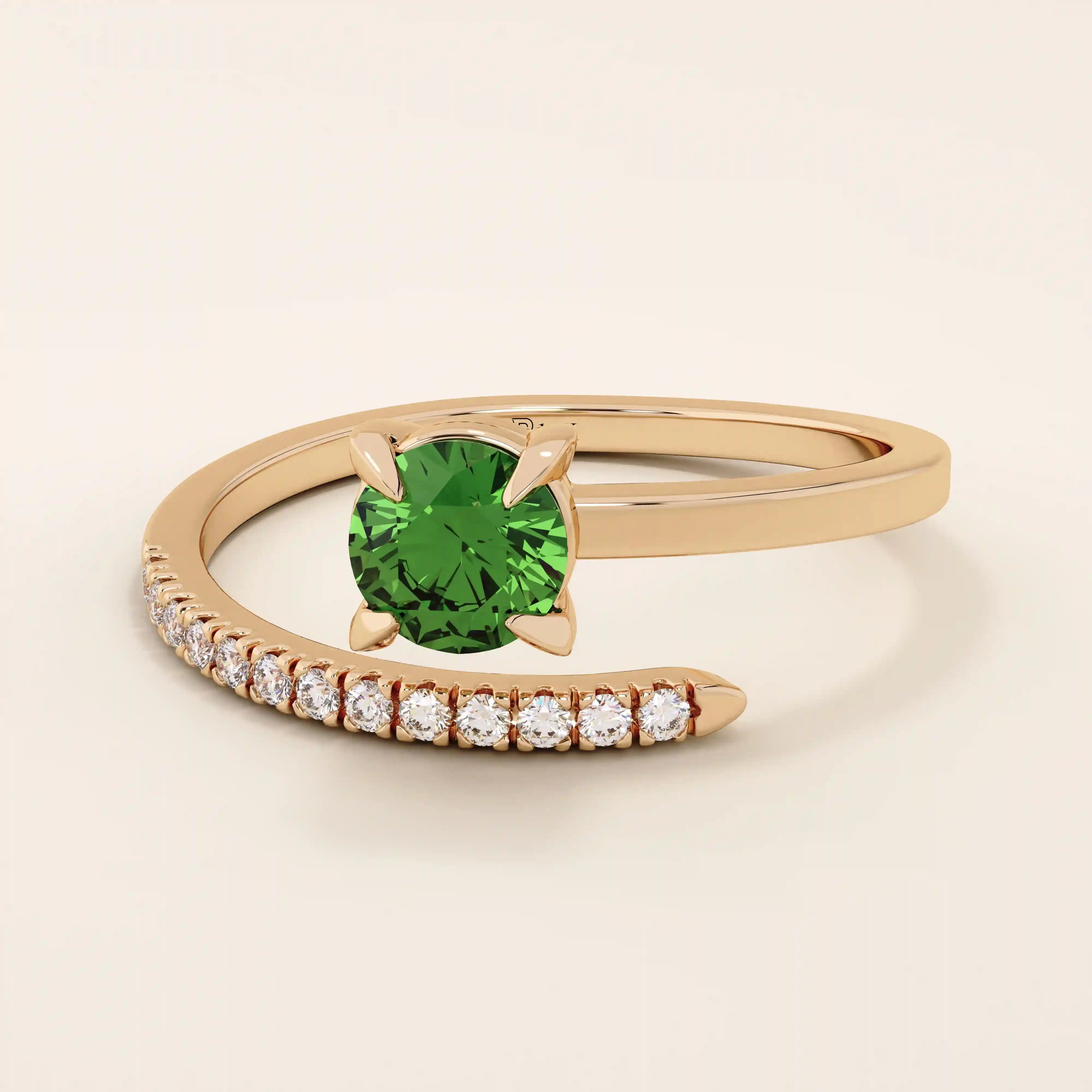 14k solid gold spiral wrap ring featuring a vivid green emerald gemstone. A bold yet elegant design with fluid curves. Perfect as a statement ring or unique gift.