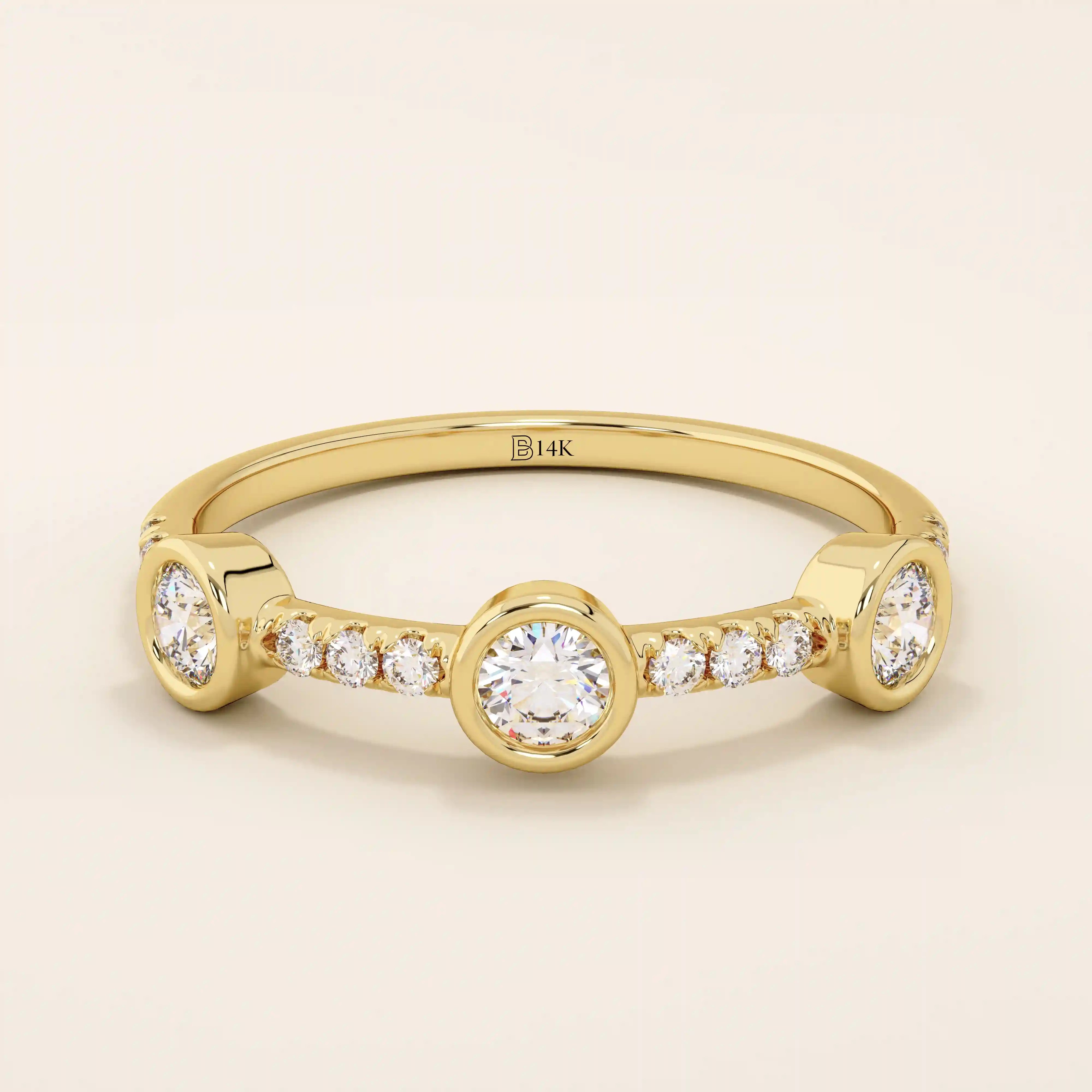 14k solid gold stacking ring featuring a half-eternity design with three bezel-set moissanites. Minimalist and versatile style.
