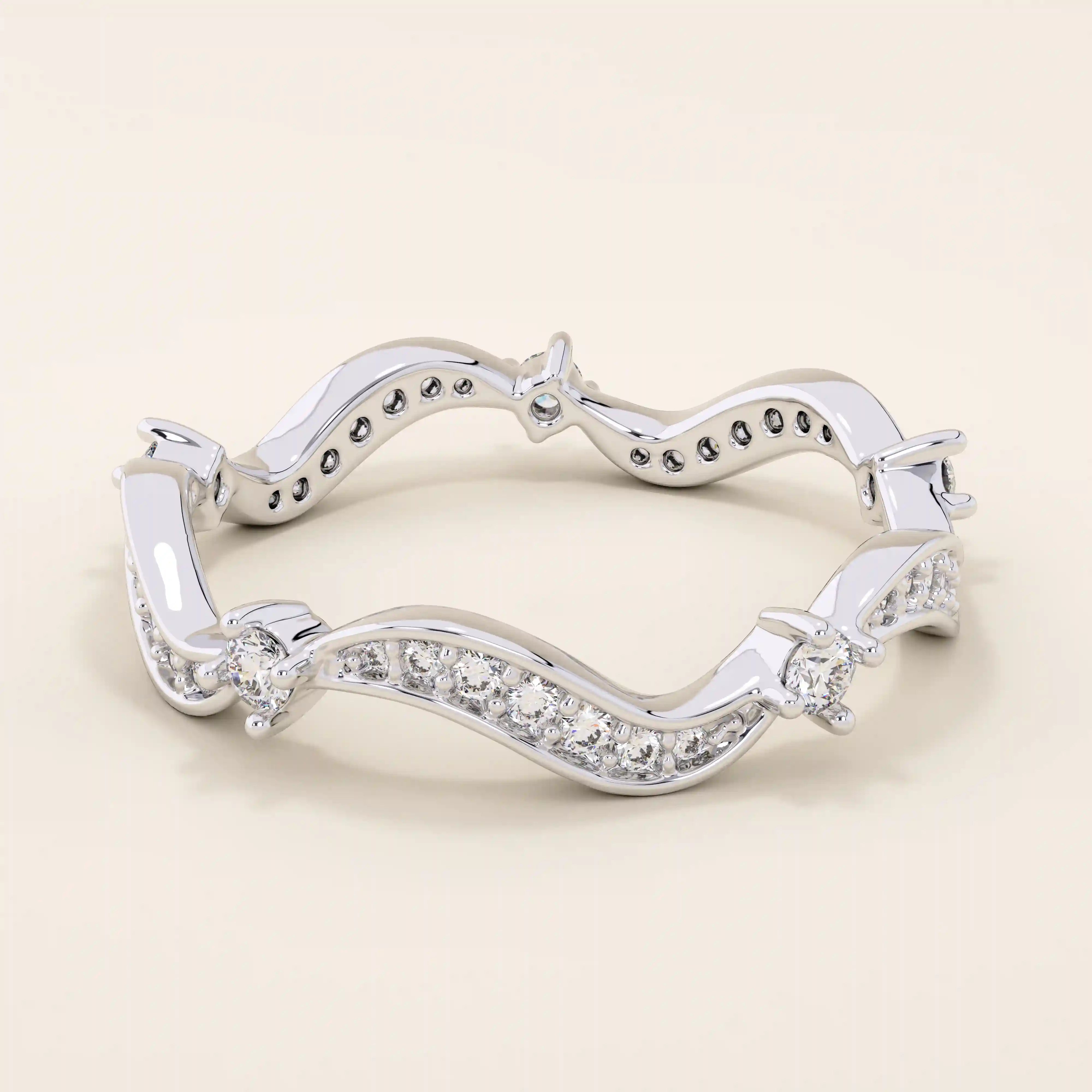 14k solid gold stacking ring featuring an ups and downs wave pattern. A modern and elegant band perfect for layering.
