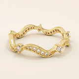 14k solid gold stacking ring featuring an ups and downs wave pattern. A modern and elegant band perfect for layering.