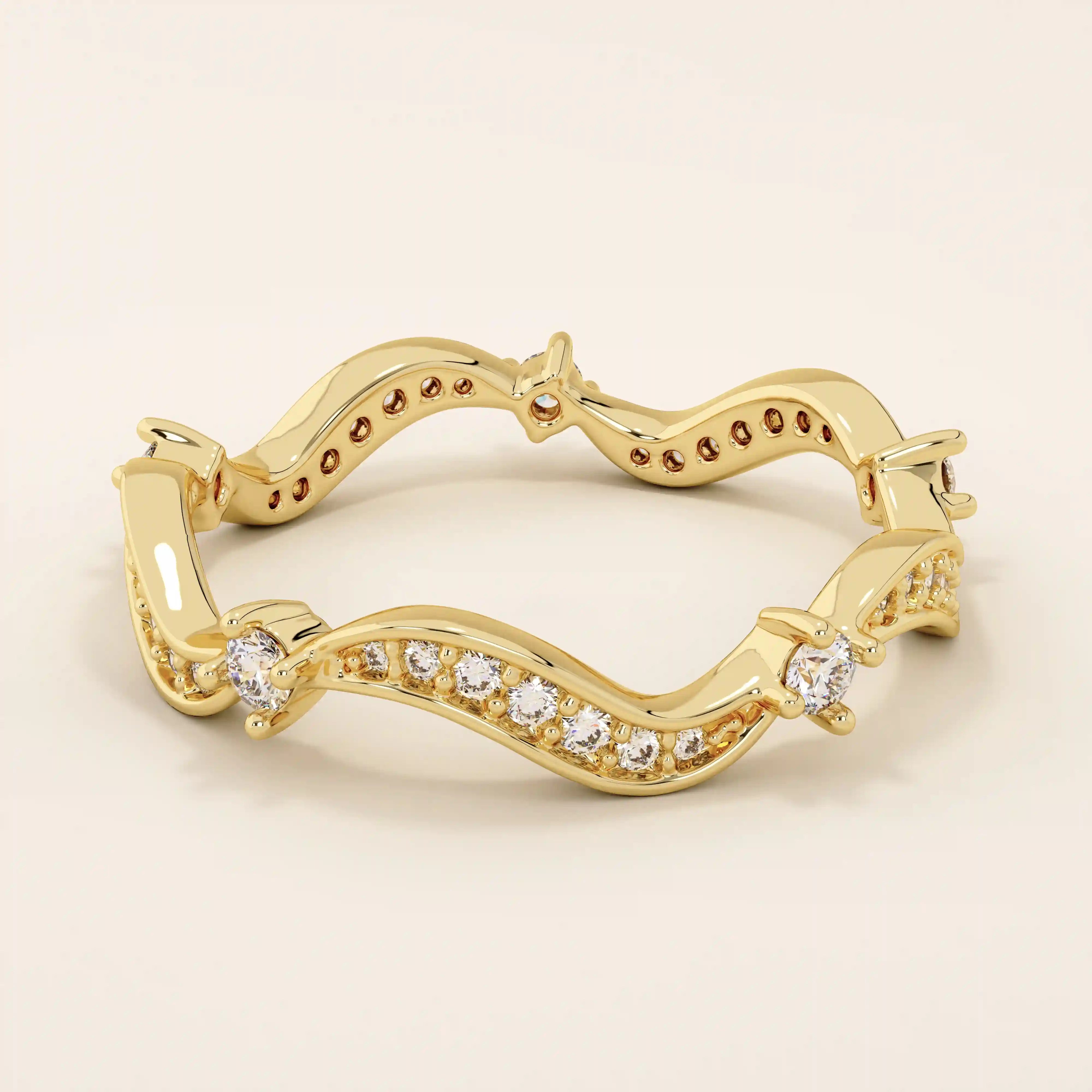 14k solid gold stacking ring featuring an ups and downs wave pattern. A modern and elegant band perfect for layering.