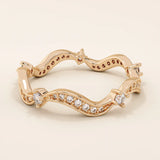 14k solid gold stacking ring featuring an ups and downs wave pattern. A modern and elegant band perfect for layering.