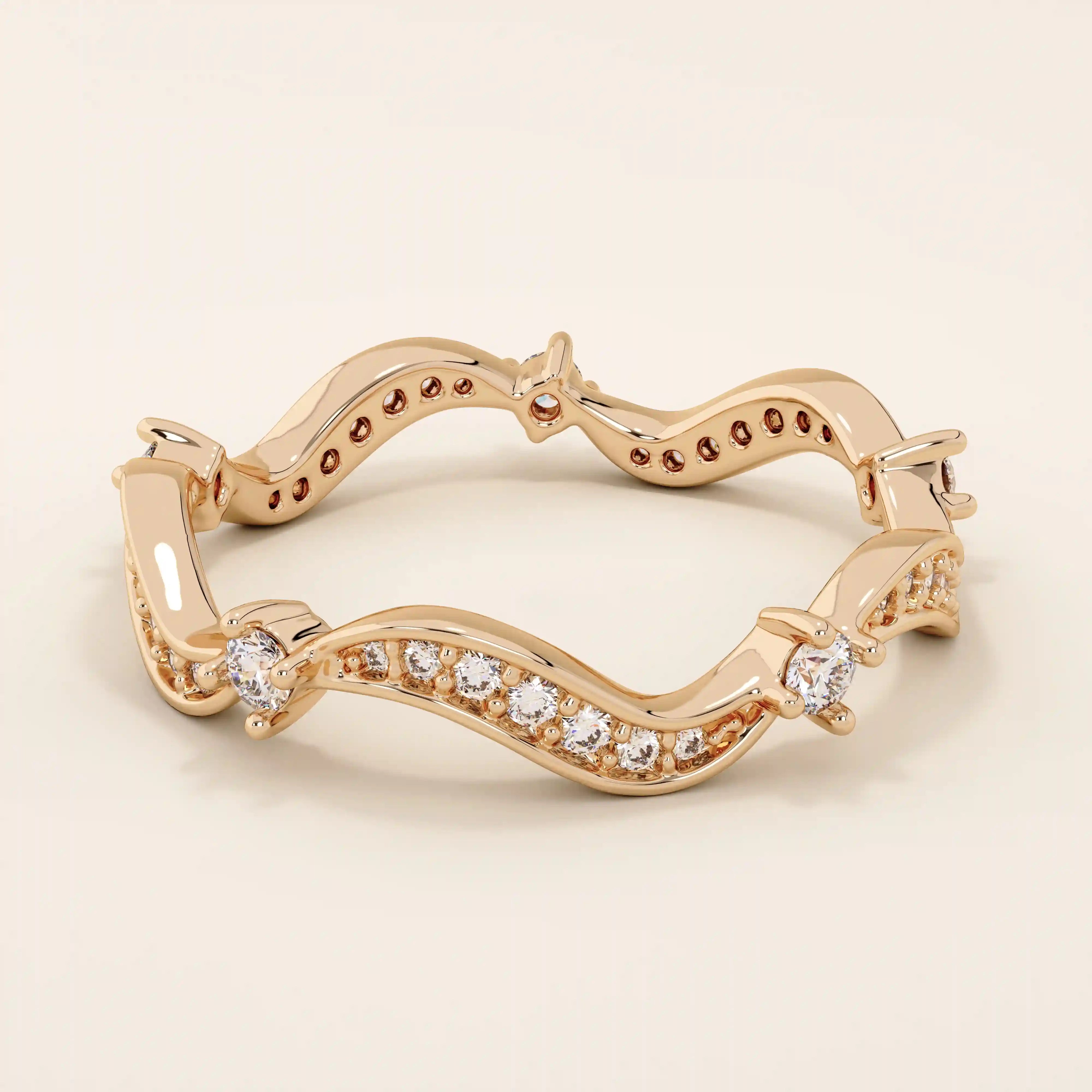 14k solid gold stacking ring featuring an ups and downs wave pattern. A modern and elegant band perfect for layering.