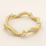 14k solid gold stacking ring featuring an ups and downs wave pattern. A modern and elegant band perfect for layering.