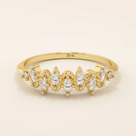 14k solid gold stacking ring with ups and downs design, paved with marquise-cut moissanites. A unique and elegant textured band.