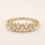 14k solid gold stacking ring with ups and downs design, paved with marquise-cut moissanites. A unique and elegant textured band.