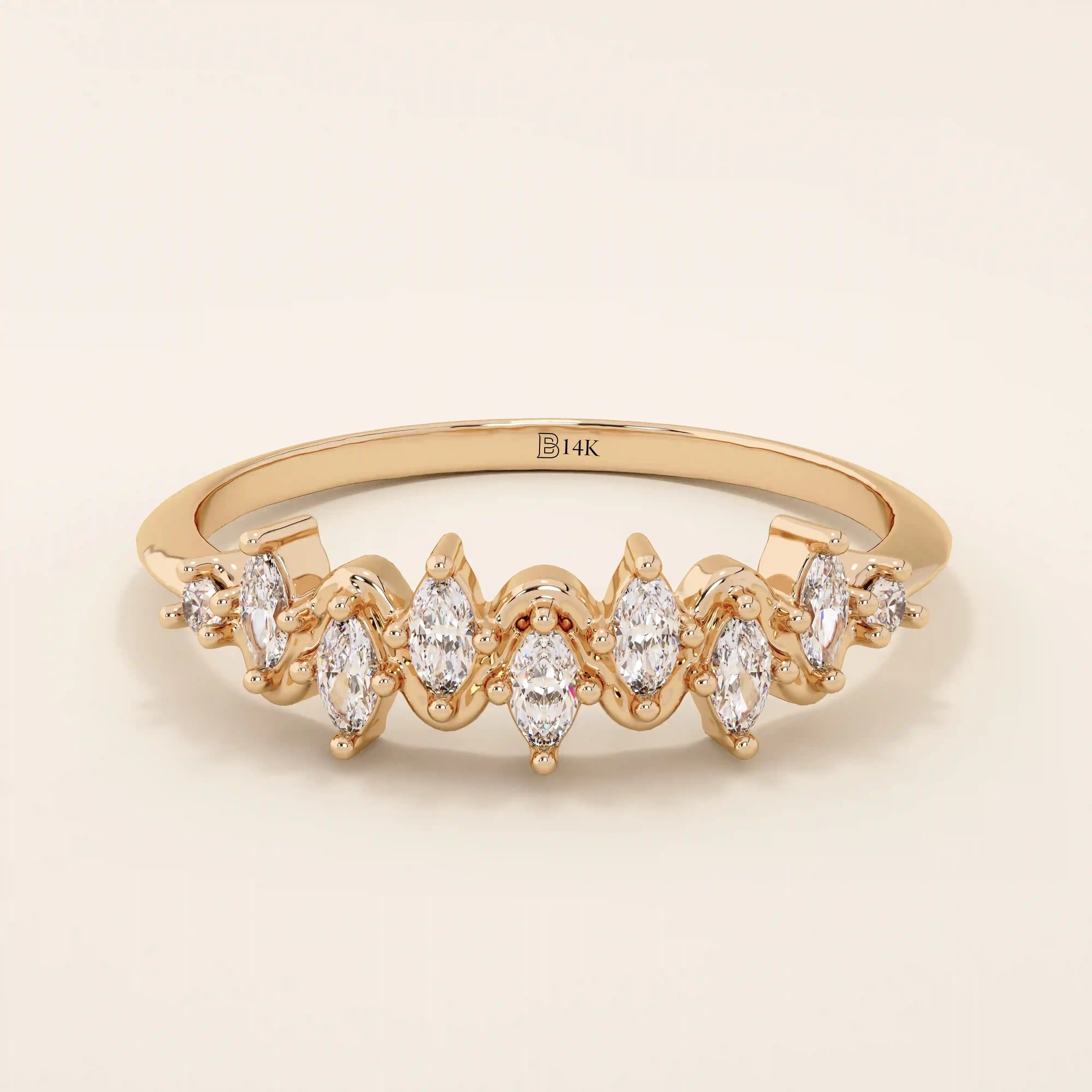 14k solid gold stacking ring with ups and downs design, paved with marquise-cut moissanites. A unique and elegant textured band.