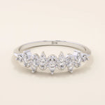 14k solid gold stacking ring with ups and downs design, paved with marquise-cut moissanites. A unique and elegant textured band.