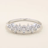 14k solid gold stacking ring with ups and downs design, paved with marquise-cut moissanites. A unique and elegant textured band.