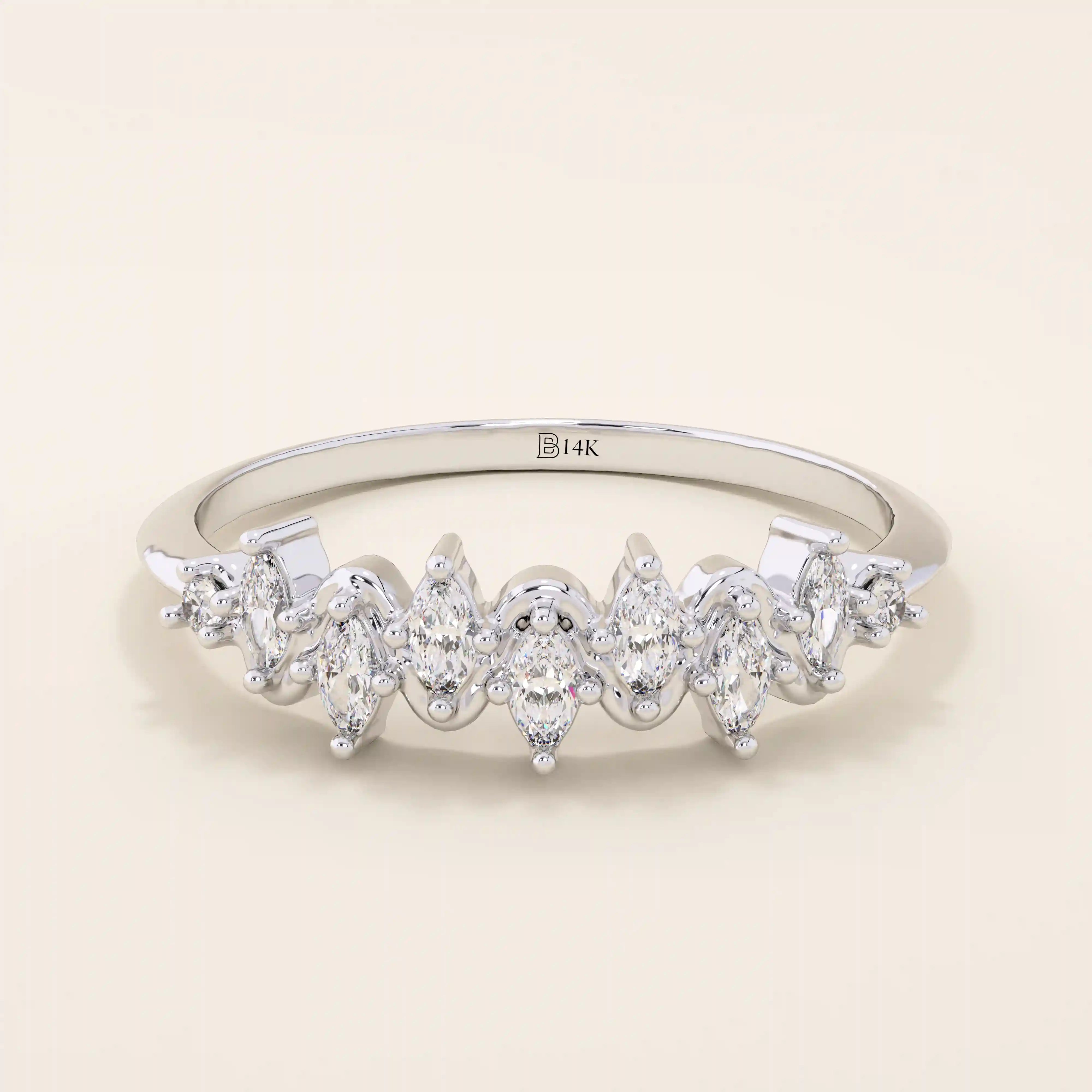 14k solid gold stacking ring with ups and downs design, paved with marquise-cut moissanites. A unique and elegant textured band.
