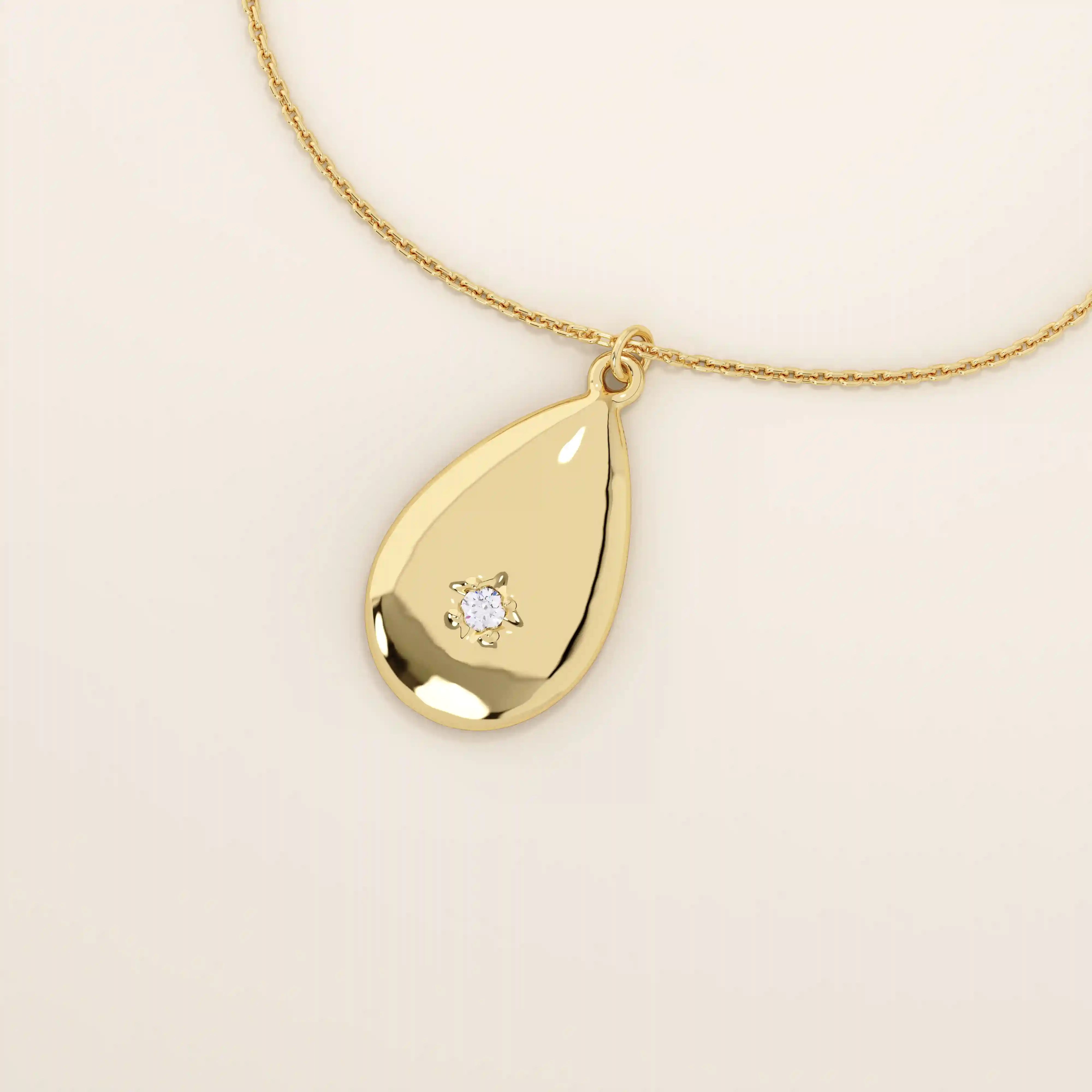 14k solid gold teardrop pendant necklace featuring a single tiny moissanite in the center. Minimalist and timeless jewelry design. Perfect for everyday wear.