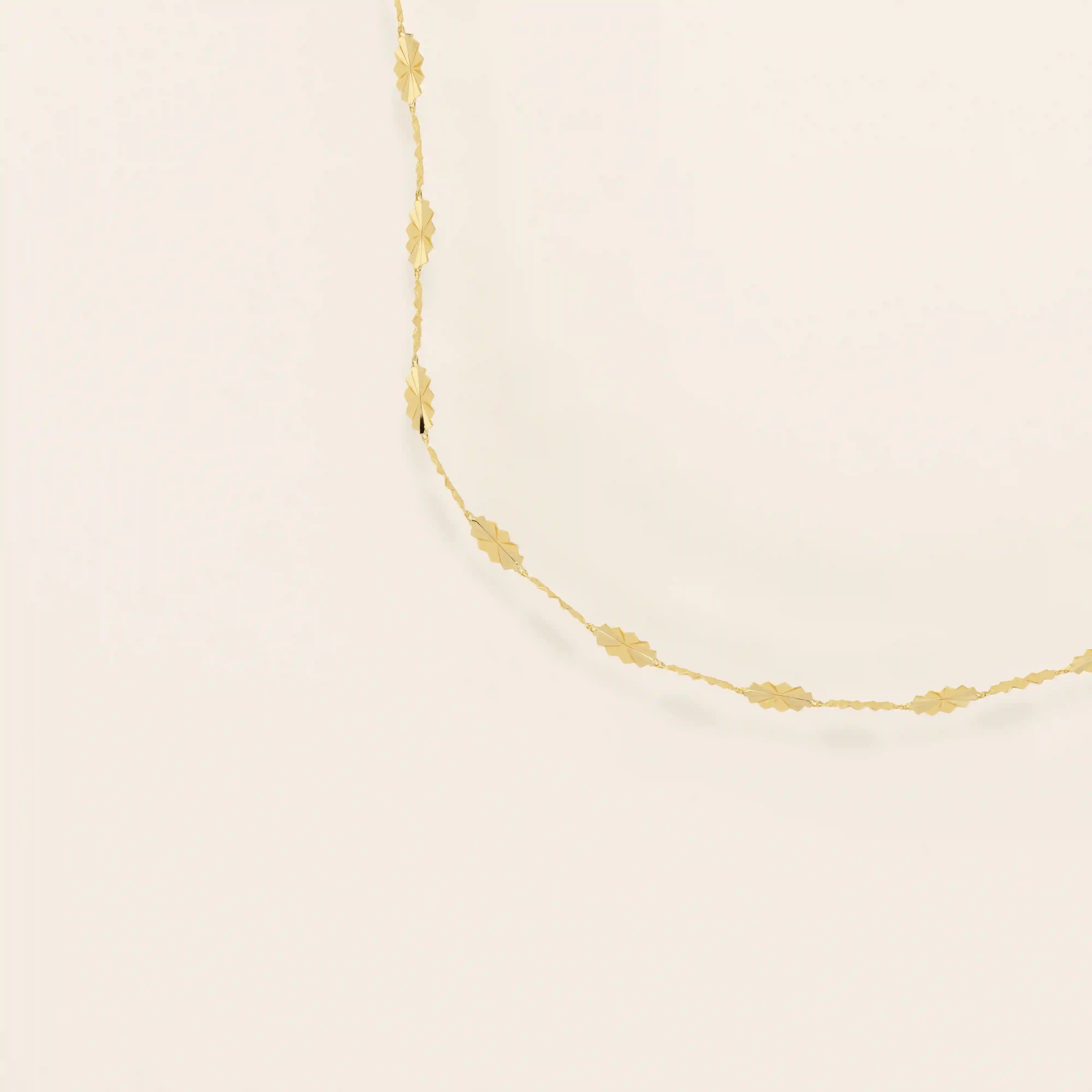 14k solid gold textured chain necklace with subtle shine and detailed finish. A classic gold chain with a unique touch. Great for everyday wear or layering.