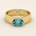 14k solid gold thick band ring with an oval cut topaz in a half bezel setting. Bold yet refined gemstone design. Perfect for stacking or solo wear.