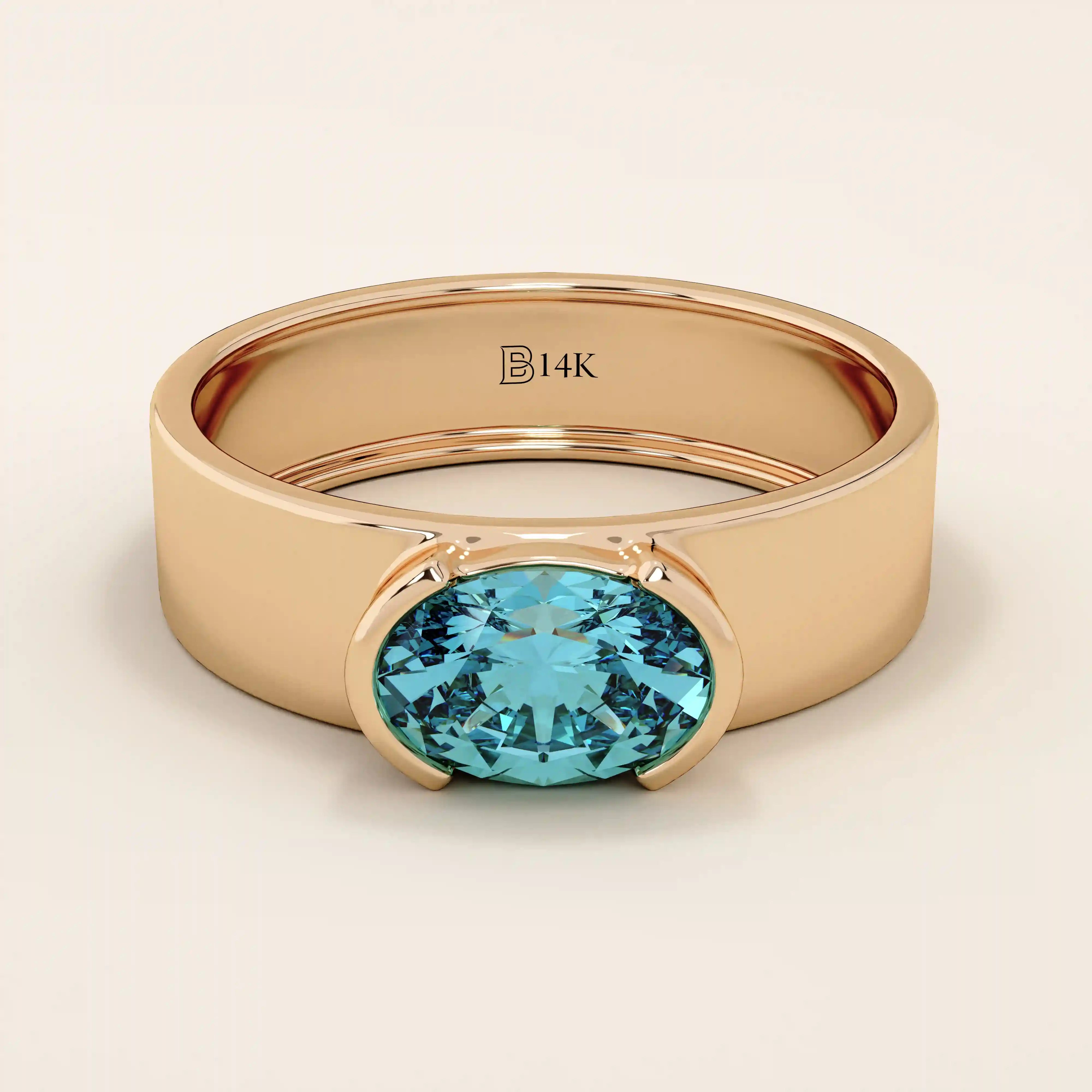 14k solid gold thick band ring with an oval cut topaz in a half bezel setting. Bold yet refined gemstone design. Perfect for stacking or solo wear.