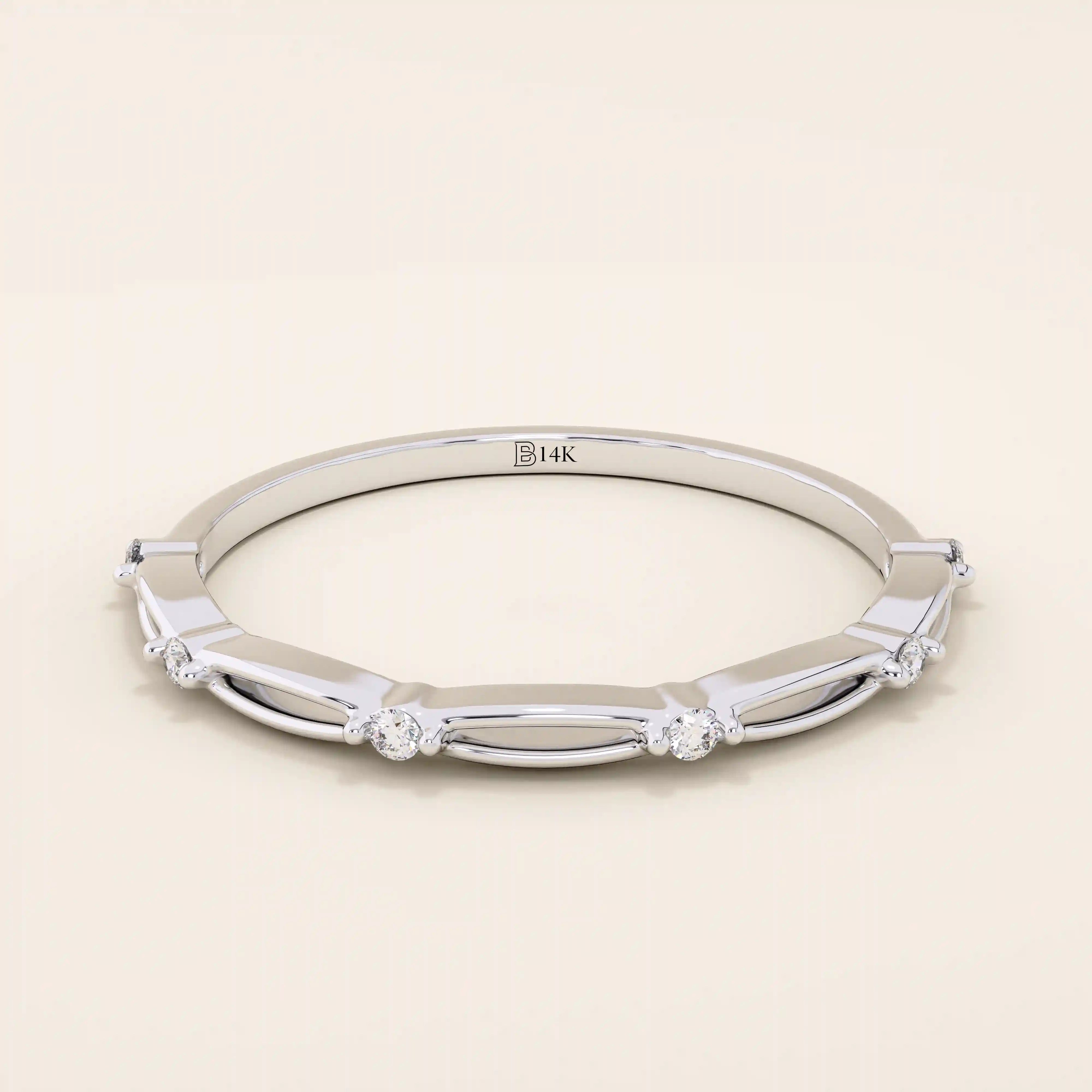 14k solid gold thin stacking ring with a minimalist design. A simple and elegant band perfect for layering.