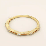 14k solid gold thin stacking ring with a minimalist design. A simple and elegant band perfect for layering.
