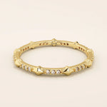14k solid gold ultra-slim stacking ring with an eternity spike design. Minimalist gold ring for layering or everyday wear.