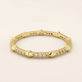 14k solid gold ultra-slim stacking ring with an eternity spike design. Minimalist gold ring for layering or everyday wear.