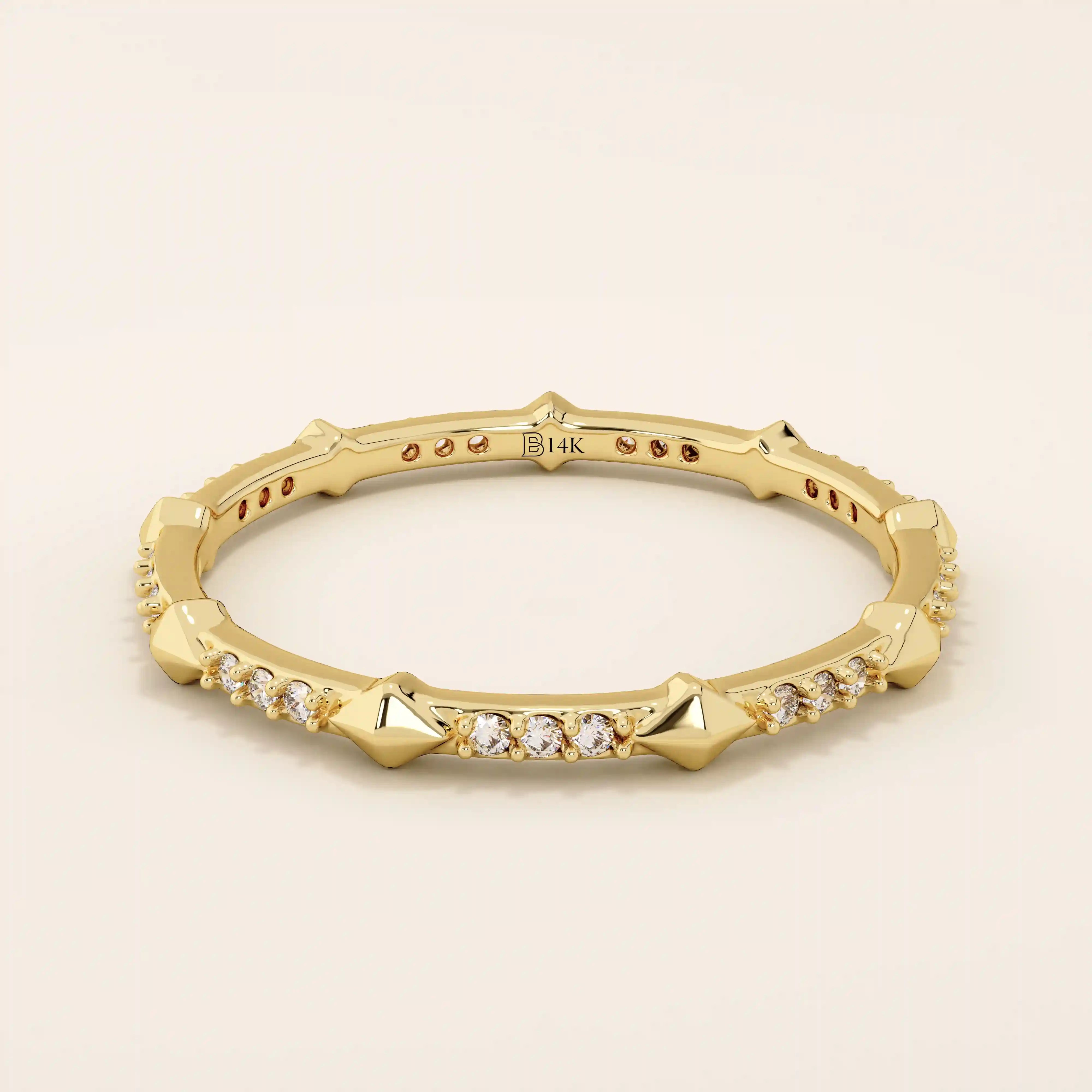 14k solid gold ultra-slim stacking ring with an eternity spike design. Minimalist gold ring for layering or everyday wear.