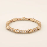 14k solid gold ultra-slim stacking ring with an eternity spike design. Minimalist gold ring for layering or everyday wear.