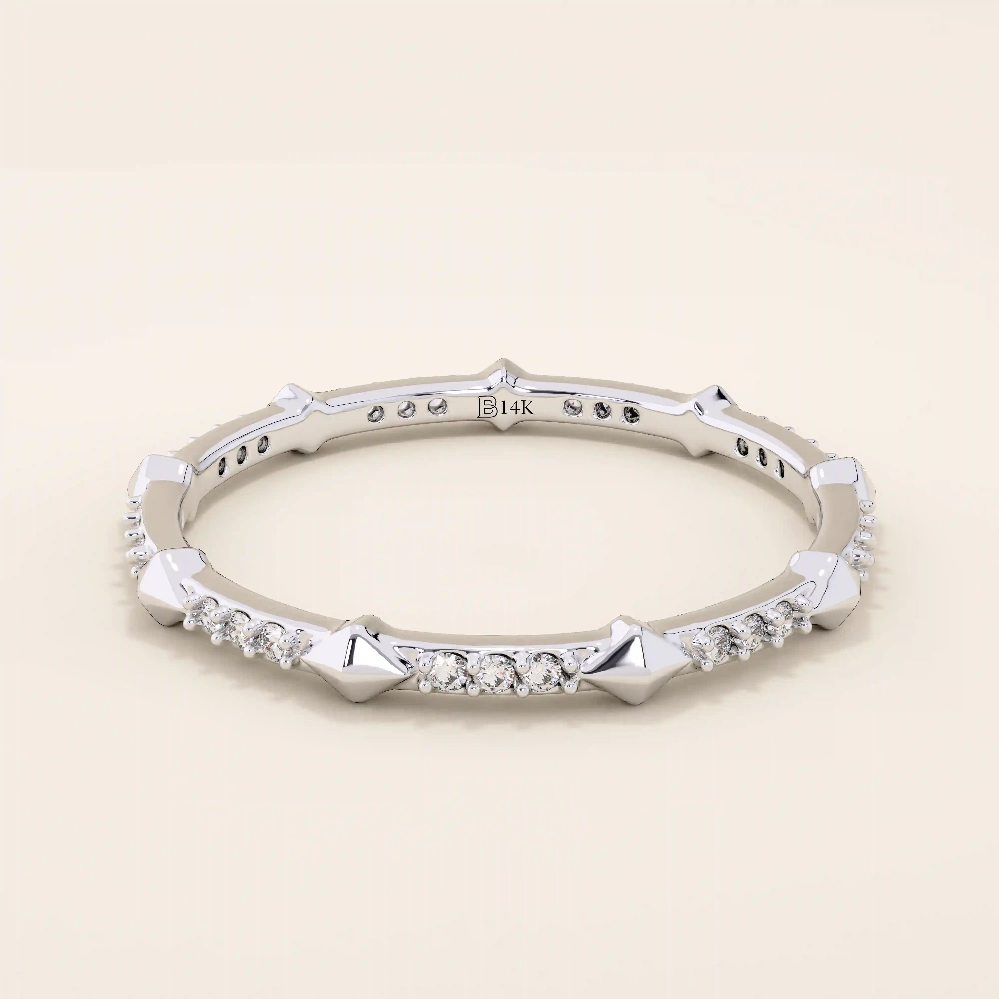 14k solid gold ultra-slim stacking ring with an eternity spike design. Minimalist gold ring for layering or everyday wear.