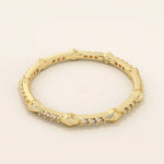 14k solid gold ultra-slim stacking ring with an eternity spike design. Minimalist gold ring for layering or everyday wear.