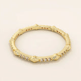 14k solid gold ultra-slim stacking ring with an eternity spike design. Minimalist gold ring for layering or everyday wear.