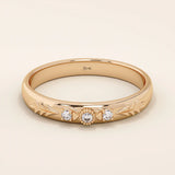14k solid gold vintage-style leaf band promise ring with intricate botanical engraving. A timeless and elegant symbol of love and nature.