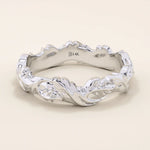 Refined 14k solid white gold ivy leaf wedding band with intricate leaf patterns encircling the ring in a continuous, textured design. The high-polish finish contrasts beautifully with the carved details, creating a timeless botanical-inspired wedding or anniversary band.
