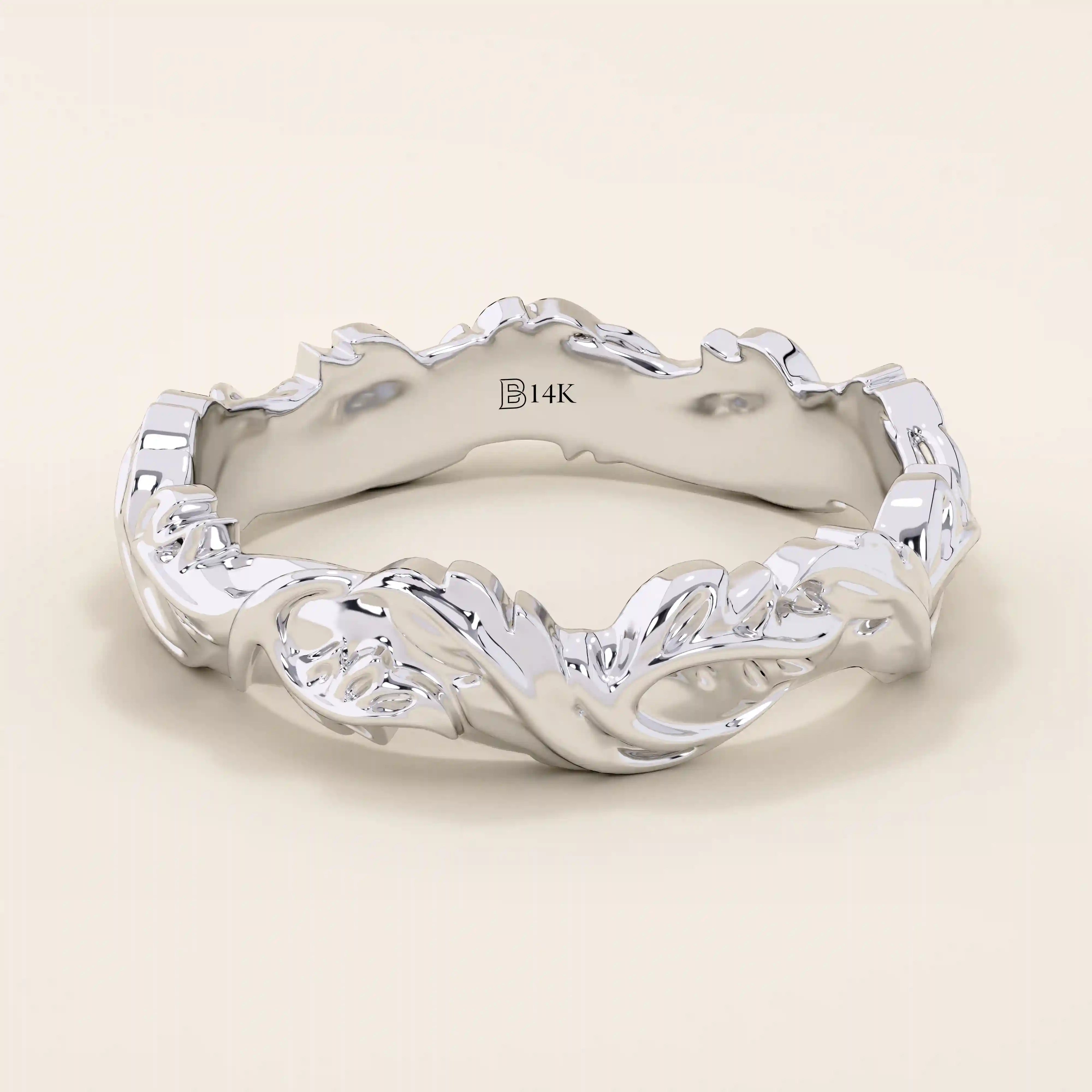 Refined 14k solid white gold ivy leaf wedding band with intricate leaf patterns encircling the ring in a continuous, textured design. The high-polish finish contrasts beautifully with the carved details, creating a timeless botanical-inspired wedding or anniversary band.
