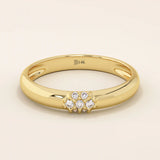 14k solid gold wedding band promise ring featuring clustered sparkling moissanites. A radiant and elegant symbol of commitment.