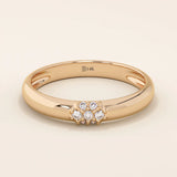 14k solid gold wedding band promise ring featuring clustered sparkling moissanites. A radiant and elegant symbol of commitment.