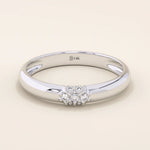 14k solid gold wedding band promise ring featuring clustered sparkling moissanites. A radiant and elegant symbol of commitment.