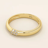 14k solid gold wedding band promise ring featuring clustered sparkling moissanites. A radiant and elegant symbol of commitment.