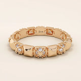 14k solid gold wedding band with pyramid-like angles and pave moissanite detailing. A bold yet refined geometric ring. Perfect as a modern wedding or stacking band.
